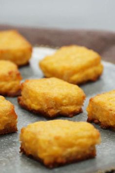 some food that is sitting on a metal tray and ready to be cooked in the oven