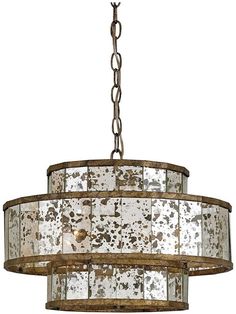 a chandelier that is hanging from a metal chain with white and brown paint on it