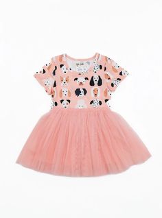 a pink dress with black and white dogs on it