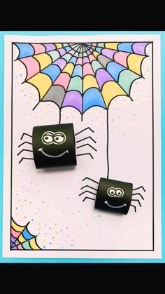 two black cufflinks with spider faces on them and an umbrella in the background