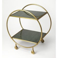 two tiered brass and glass serving cart with wheels on each side, in the shape of a circle