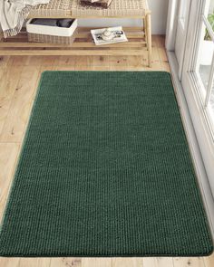 a green area rug in a living room