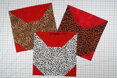 three different pieces of fabric on top of each other, one is red and the other is leopard print