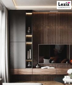 a modern living room with dark wood paneling and white couches in front of the tv