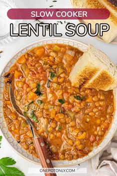 a bowl of lentil soup with bread on the side and text overlay that reads slow cooker lentil soup