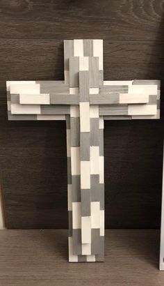 a wooden cross sitting on top of a table