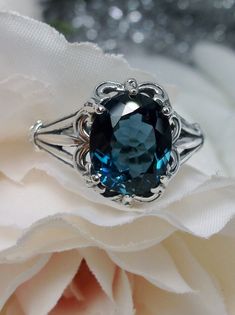 "<>#145  This is a brand new stunning Gothic/Renaissance inspired sterling silver filigree ring. The flawless oval-cut high-quality VVS 3.5ct London blue natural topaz is 11mm (7/16th of an inch) by 9mm (just shy of 3/8\" inch) in dimension... The inside of the band is marked 925 for sterling. This topaz has great color and clarity. Notice the beautiful filigree swirl like the craftsmanship of the silver setting. This is an exquisite rendition of a Gothic design filigree ring.... and is re Russian Ring, London Topaz Ring, London Topaz, Gothic Ring, Gothic Design, Filigree Jewelry, Sterling Silver Filigree, Filigree Ring, Blue Topaz Ring