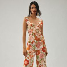 Heliconia Ruffle Jumpsuit Elegant Fitted Floral Jumpsuits And Rompers, Spring Floral Print Jumpsuits And Rompers For Date Night, Summer Floral Print Jumpsuits And Rompers For Date Night, Elegant Floral Print Jumpsuits And Rompers, Fitted Jumpsuits And Rompers For Summer Cocktail, Fitted Cocktail Jumpsuits And Rompers For Summer, Fitted Glamorous Jumpsuits And Rompers For Summer, Glamorous Summer Jumpsuits And Rompers For Date Night, Feminine Sleeveless Jumpsuits And Rompers For Spring