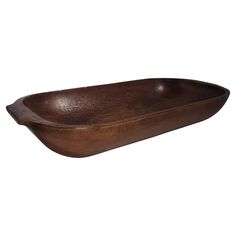 an oval wooden bowl on a white background