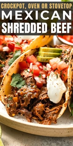 the mexican shredded beef is served with avocado, tomatoes and cilantro