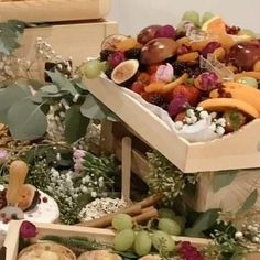 several wooden boxes filled with different types of fruit