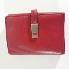 This vintage, smooth red leather wallet has a snap closing and lots of interior details make it versatile.  Perfect for grab and go, drop into a bag or brief, or give as a gift. Red leather exterior, fabric and synthetic interior. Inside: 6 card slots, ID window, zip compartment, divided bill compartment. closed 4 1/2 inches x 3 1/4 inches open 4 1/2 inches x 9 1/2 inches Buxton is a time honored producer of leather goods.  The outside of this wallet is genuine smooth leather.  The inside is a combination of fabric and faux leather.  This wallet is new old stock, vintage, and never used. Scratches and wrinkles, as well as variations in tone, are authentic features of genuine leather--they are not imperfections.  Colors may appear to be different depending on your monitor. Shipping based on Cheap Red Trifold Wallet, Cheap Red Trifold Wallet With Coin Pocket, Cheap Red Trifold Wallet With Rfid Blocking, Cheap Red Men's Wallet, Cheap Red Wallets With Multiple Compartments, Cheap Red Trifold Wallet For Travel, Cheap Red Wallets With Zipper Closure, Cheap Red Trifold Wallet As Gift, Cheap Vintage Red Wallets