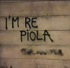 graffiti written on the side of a building that says i'm re piola