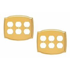 two gold plated metal outlet covers with holes on each side and an oval hole in the middle