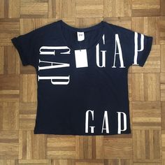 New With Tags, 100% Cotton Gap Navy And White Loose Boxy T-Shirt. Measurements: Pit To Pit About 20in, Shoulder To Hem About 22in Gap Blue Graphic Print Top, Blue Graphic Print Tops From Gap, Gap Graphic Print Relaxed Fit Tops, Blue Graphic Print Gap Tops, Gap Relaxed Fit Top With Graphic Print, Gap Relaxed Fit Graphic Print Top, Gap Short Sleeve Tops With Letter Print, Gap Cotton Tops With Logo Print, Gap White Graphic Print Top