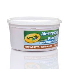 a container of air dry clay sits on a white surface