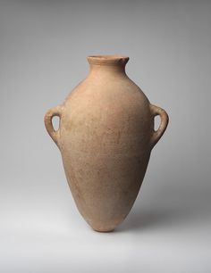 an old vase is shown on a gray background