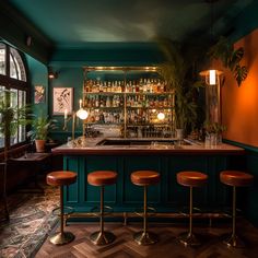 a bar with three stools in front of it