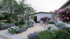 a house with flowers and shrubs around it