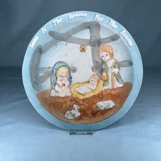 a plate with nativity scene painted on it