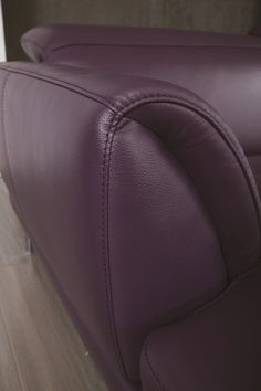 the back end of a purple leather couch