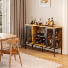 a dining room with a table and chairs next to a wine rack filled with bottles