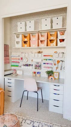 a white desk with lots of crafting supplies on top of it and storage bins