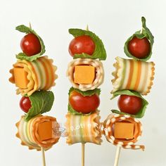 some food is arranged on sticks and ready to be eaten