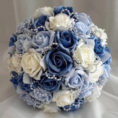 a bridal bouquet with blue and white flowers