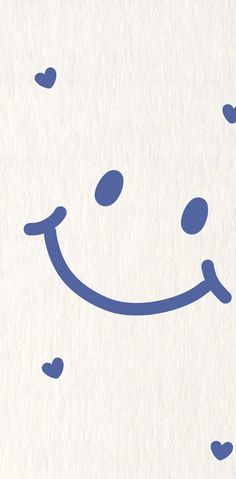 a blue smiley face drawn on white paper