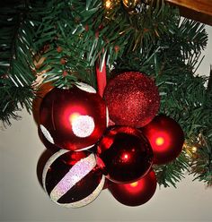 red and silver ornaments hanging from a christmas tree