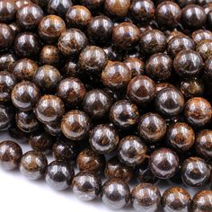 the beads are brown in color and have black spots on each beaded strands