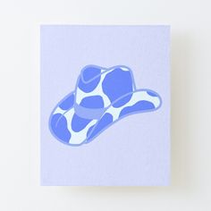 a blue and white cowboy hat on a light gray background canvas print mounted on a wall