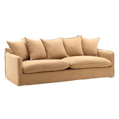 a tan couch with pillows on it