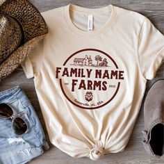 Customize this shirt with your family name, established year, and town of your home / farm. Great gift for newlywed, new home owner, farmer, chicken lover, etc... ❤️Love the design and want it in a sweatshirt? We got you covered. Tap here:  https://cottoncropshop.etsy.com/listing/1682115050/personalized-family-farm-sweatshirts SHORT SLEEVE TSHIRT FIT: ⚡️TAPERED SHOULDERS - so it retains its shape even after washing. ⚡️CREW NECKLINE adds a timeless, classic touch and a neat appearance that is per Farm T Shirt Designs, Family Farm Shirts Ideas, Farm T Shirt Ideas, Personalized Cotton T-shirt For Family Gatherings, Custom Text T-shirt For Family Gatherings, Custom Text Crew Neck T-shirt For Family Gatherings, Custom Text Crew Neck Tops For Family Gatherings, Custom Text Cotton Tops For Family Events, Funny Farm Shirts