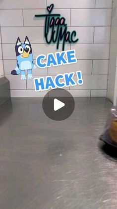 a cake has been placed in front of a sign that says'come cake hack '