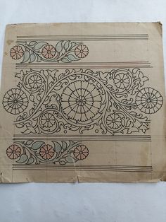 an old piece of paper with designs on it