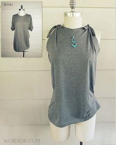 a mannequin wearing a gray top with an anchor necklace