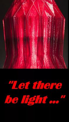 a red vase with the words let there be light on it