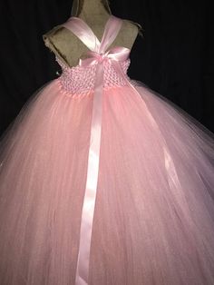 This adorably Pink Princess dress will be the hit of any celebration. Not like any costume that you would find in a store. It is super poofy! She will feel like the belle of the ball and twirl everywhere. The light pink crochet top is lined, making it soft and not see-through! The dress is