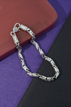 Embrace a symbol of tranquility with this pure silver bracelet, handcrafted for both women and men. Its unique peace pattern is fashioned for the trend-savvy individual, a fine jewelry gift that offers more than style; it signifies serenity. Ideal for gifting, or as your personal emblem of peace. Traditional Silver Chain Bracelets Gift, Traditional Chain Bracelet With Sterling Silver Clasp As Gift, Traditional Sterling Silver Braided Bracelet As Gift, Symbolic Bracelet With Sterling Silver Clasp For Gift, Spiritual Chain Bracelet With Sterling Silver Clasp, Silver Braided Bracelets As A Gift, Spiritual Sterling Silver Chain Bracelet, Everyday Silver Spiritual Bracelets, Traditional Bracelets With Sterling Silver Clasp For Gift