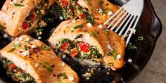 a close up of food on a pan with a fork