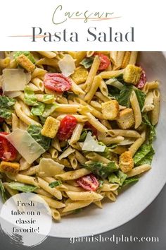 pasta salad in a white bowl with text overlay that reads, caesar pasta pesto salad