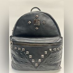 Mcm Black Leather Studded Back Pack Gray Cloth Fabric Interior With Zip Compartment Adjustable Back Straps 12”-16” Drop Item Shows Signs Of Wear Such As Missing Zipper Pulls, Tarnishing Hardware, Scratches On Leather And Hardware, Scuffs, And Marks Due To Being Pre-Owned. Please Refer To The Photos For Details. Available In Store For $340 Eldwx81808 Mcm Backpack, Mcm Bags, Grey Outfit, Cloth Fabric, Zipper Pulls, Back Strap, Black Leather, Size 12, Bag Lady