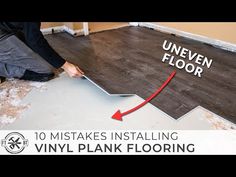 a man is installing vinyl plank flooring in an unfinished room with the words uneven floor