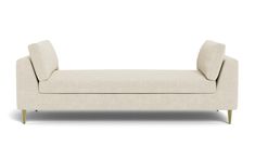 a white couch sitting on top of a wooden frame