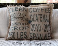 a close up of a pillow on a couch with words written in black and white