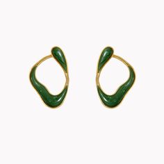 These stunning earrings feature nephrite jade framed by flowing 18K yellow gold. The 18K yellow gold setting is crafted with a subtle rope-like texture, creating a lovely contrast with the smooth, luminous stone. Part of the Fernando Jorge Stream Collection, these unique earrings loop from the front of the earlobe around to the back, evoking one continuous line of movement. Nephrite Jade, Loop Earrings, Continuous Line, Yellow Gold Setting, Stunning Earrings, Unique Earrings, Jade, Yellow Gold, Texture