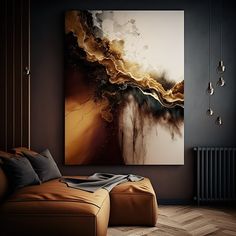 an abstract painting hangs on the wall next to a couch and ottoman in a dark room