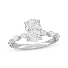 an oval cut diamond ring set in 18k white gold